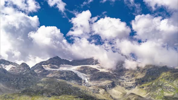 Time Lapse Of Moving Clouds On Mountain Ridge With Glacier2