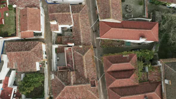 Aerial Top View Of Tiled Roof Houses In The Medieval Town Of Óbidos Portugal - aerial drone shot