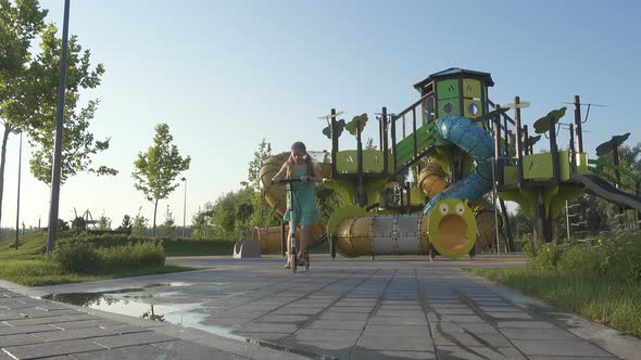 Child Girl Riding A Scooter 12