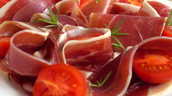 Jamon with tomatoes and rosemary.