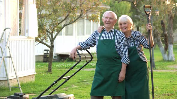 Smiling Couple of Senior Gardeners.