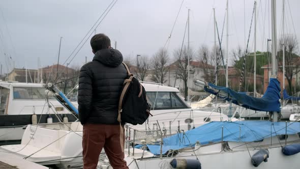 Man Is Walking on Italian Street Via Destra Del Port in Rimini