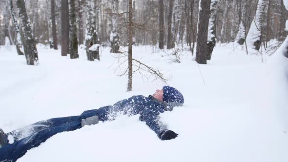 a Child Fall in the Snow in Slowmotion