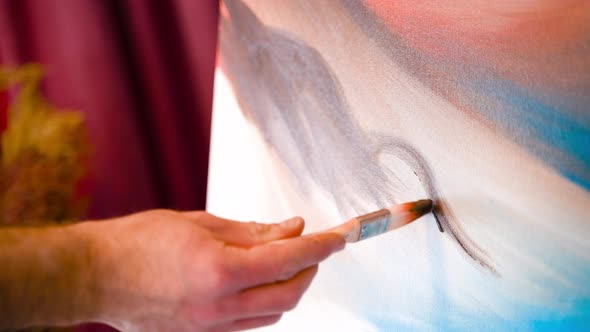Close-up of brush applied to painting.