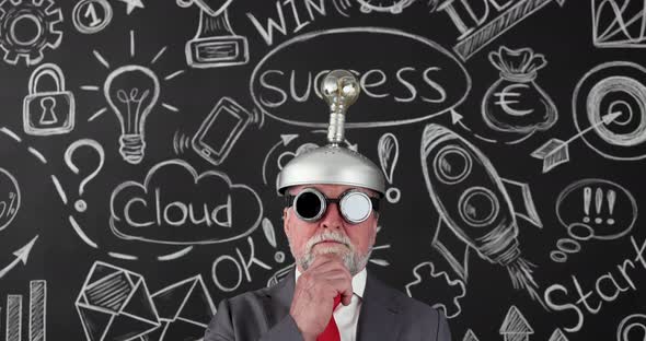 Senior man wearing handmade helmet with lightbulb