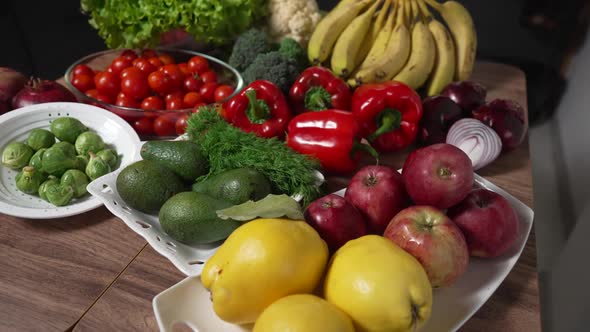 Fresh Fruits and Vegetables on Dark Kitchen Table