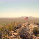 American US Flag on Top of Desert Mountain Flyby - VideoHive Item for Sale