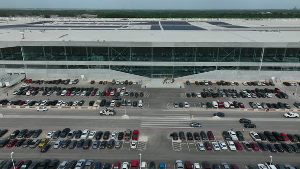 Rising aerial of Tesla Giga Texas facility in Austin. Manufacture of Model Y. Rooftop solar panels.