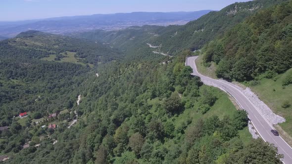 Aerial view of a winding mountain road in Italy