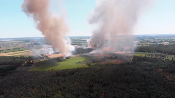 Aerial View of Fire in Wheat Field. Flying Over Smoke Above Agricultural Fields