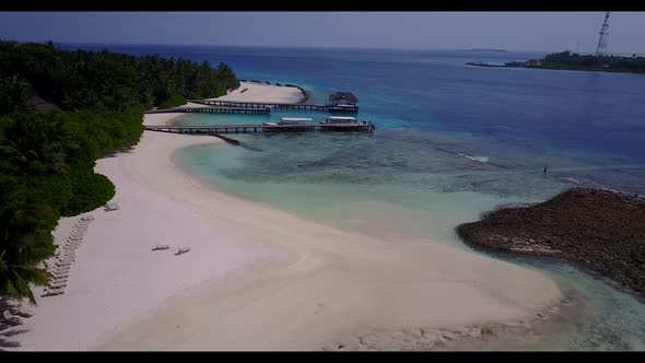 Aerial top down scenery of exotic island beach holiday by turquoise water and clean sand background 