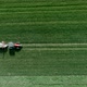 Tractor Spraying Field Aerial footage - VideoHive Item for Sale