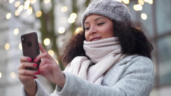 Woman Taking Selfie on Mobile Phone Outside on Winter Street Spbi