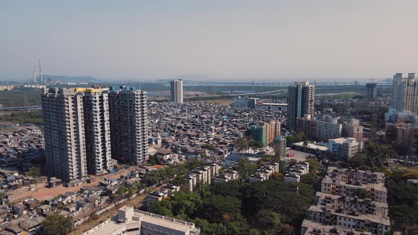 Aerial view of Mumbai city, Maharashtra. Drone shot of both high-rise buildings and slums.