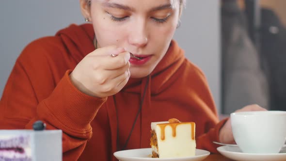 Girl Is Breaking Off a Piece and Eating