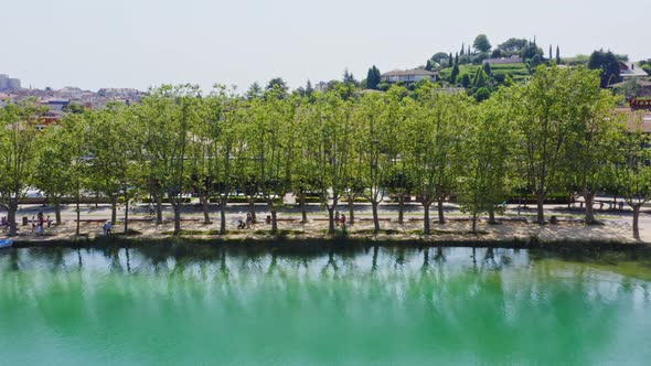 Tree lined avenues along the shore of Lake Banyoles Catalonia Spain. A popular tourist destination.