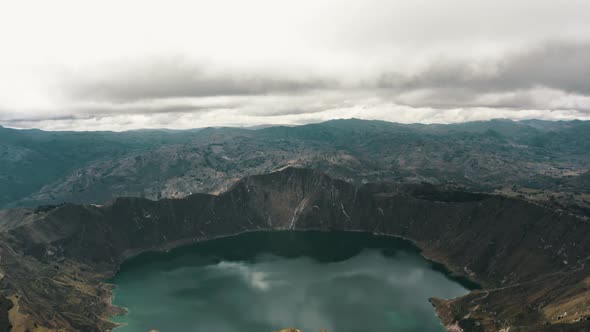 Panoramic view of wonderful crater lake landscape surrounded by volcanoes in Ecuador