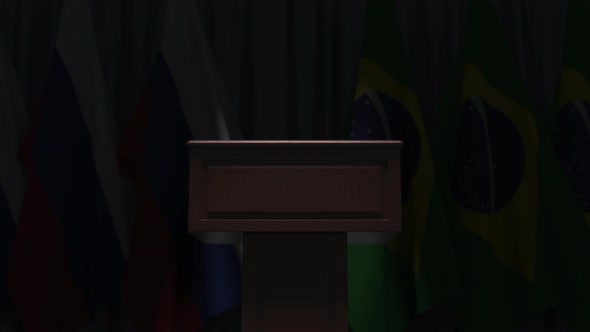 Many Flags of Brazil and Russia Behind Speaker Tribune alt