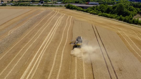 Top down view of Harvester machine working in wheat field 