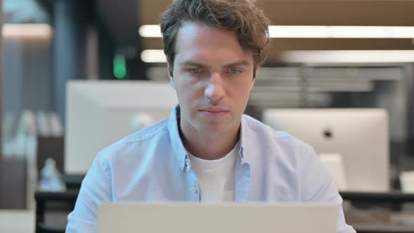 Close Up of Man Having Headache While Using Laptop