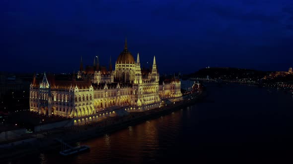 Aerial Wide Footage of Danube River and Budapest City Skyline at Night Time