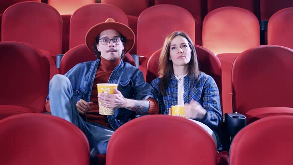 Guy and Girl Enjoying a Film at the Cinema