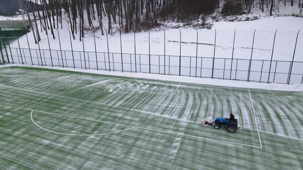 Cleaning the Football Field From Snow