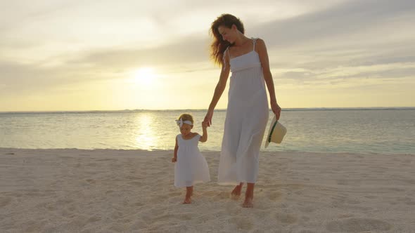 Small Girl Walking with Mother at Tropical Beach on Slow Motion Video