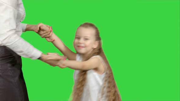 Mother and Daughter Having Fun Dancing on a Green Screen, Chroma Key