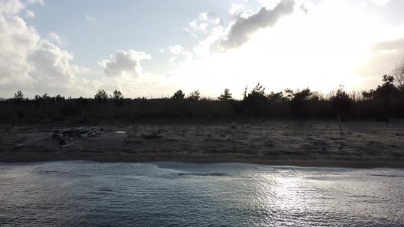 Smooth aerial view flight slider fly sideways from right to left drone footage of the coastline wave