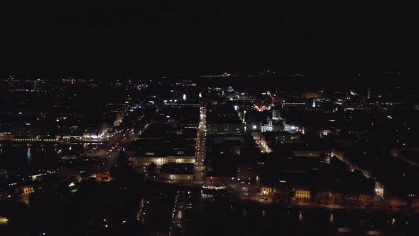 Aerial, tracking, drone shot, of the Kauppatori market square, the Helsinki cathedral and buildings