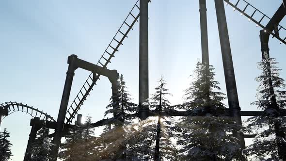 Old Roller Coaster at Sunset in Forest