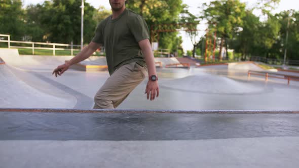 Skateboarder Doing a Tricks in a Concrete Skate Park Close Up Slow Motion