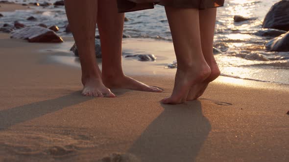 Romantic young couple on the background of the sea sunset