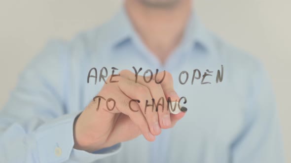 Are You Open to Change, Man Writing on Transparent Screen