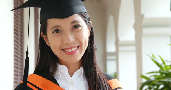 Asian woman get graduation in university campus
