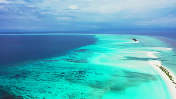 Aerial sky of tropical resort beach break by turquoise ocean and white sandy background of a dayout 