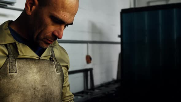 Welder standing at workshop