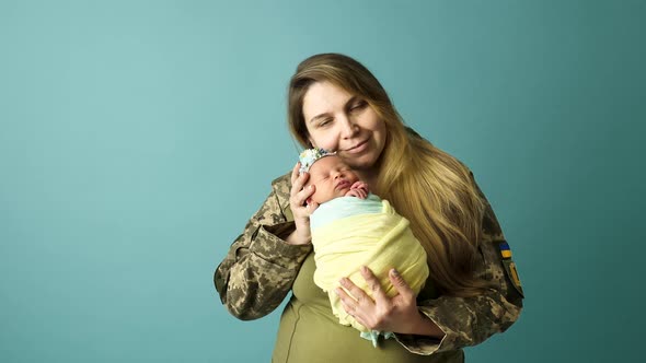 Ukrainian Military Woman Mother with Baby