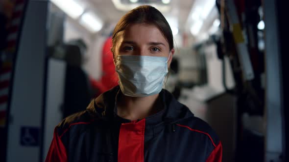 Paramedic in Medical Mask Posing at Camera