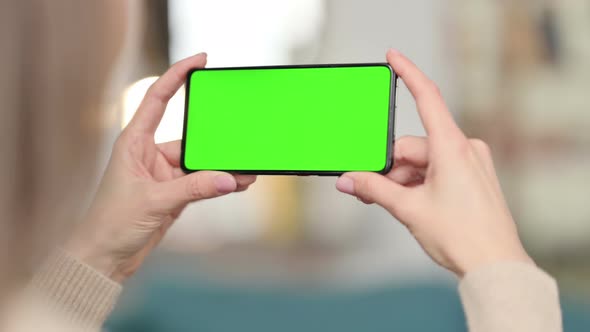 Woman Watching Smartphone with Green Screen, Chroma Screen 