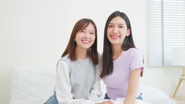 Portrait of Asian beautiful two women friend smiling, look at camera.