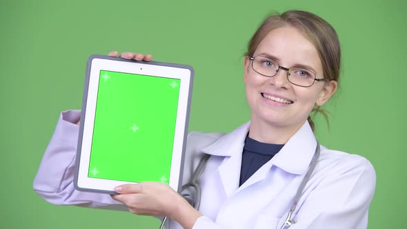 Young Happy Woman Doctor Showing Digital Tablet