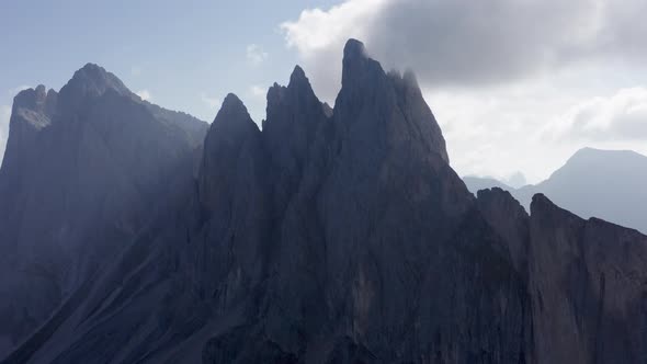 Aerial Shot with Fog Along the Mountaintop Seen in Seceda Italy