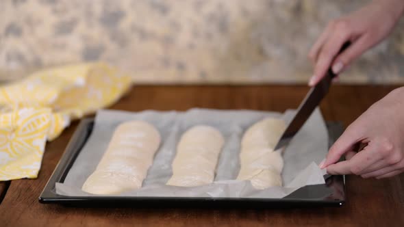 Woman makes homemade baguettes, Organic handmade baguette traditional french bread