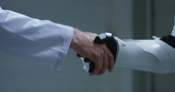 Man and Robot Shaking Hands