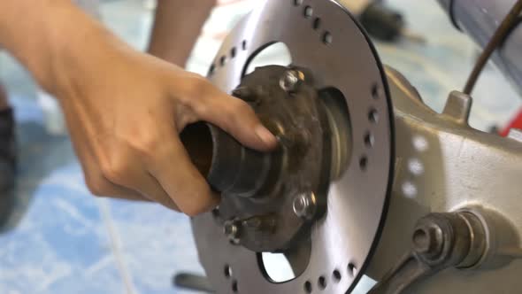 Close-up Footage of The Technician Working On Motorcycle Brake Caliper Cleaning Process