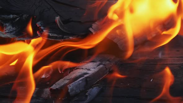 Close Up of Pile of Wood Burning with Flames