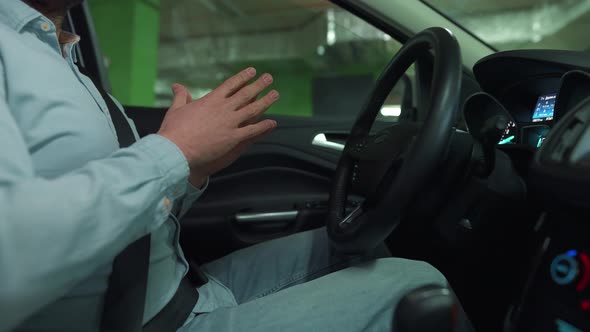 Man Driving in Innovative Automated Car Using Selfparking Autopilot for Parking on Parking Lot