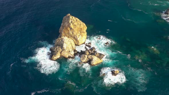 Thousands of Birds Fly Over a Small Island Aerial View